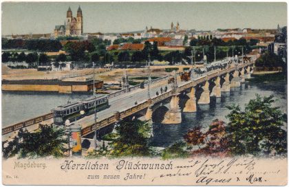 Eine historische Ansichtskarte der „langen Brücke“ zeigt eine Elektrische mit Blick Richtung Dom um 1912. (AK Louis Koch, Sammlung: Ralf Kozica)